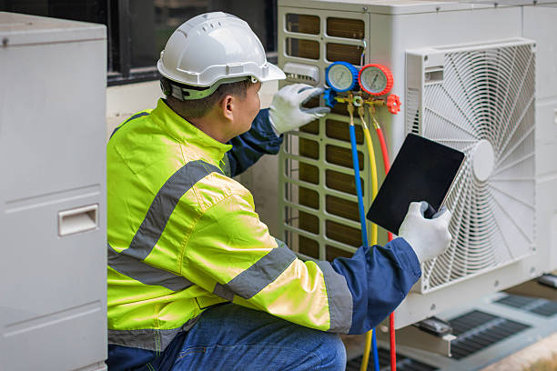 Professional Heat Pump Repair technician working in Hampton, CT